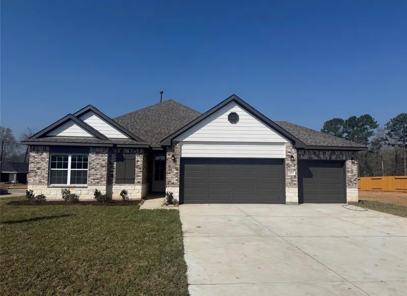 Front exterior of 11803 Serena's Song Drive, a new home by Alta Homes, Willis, TX