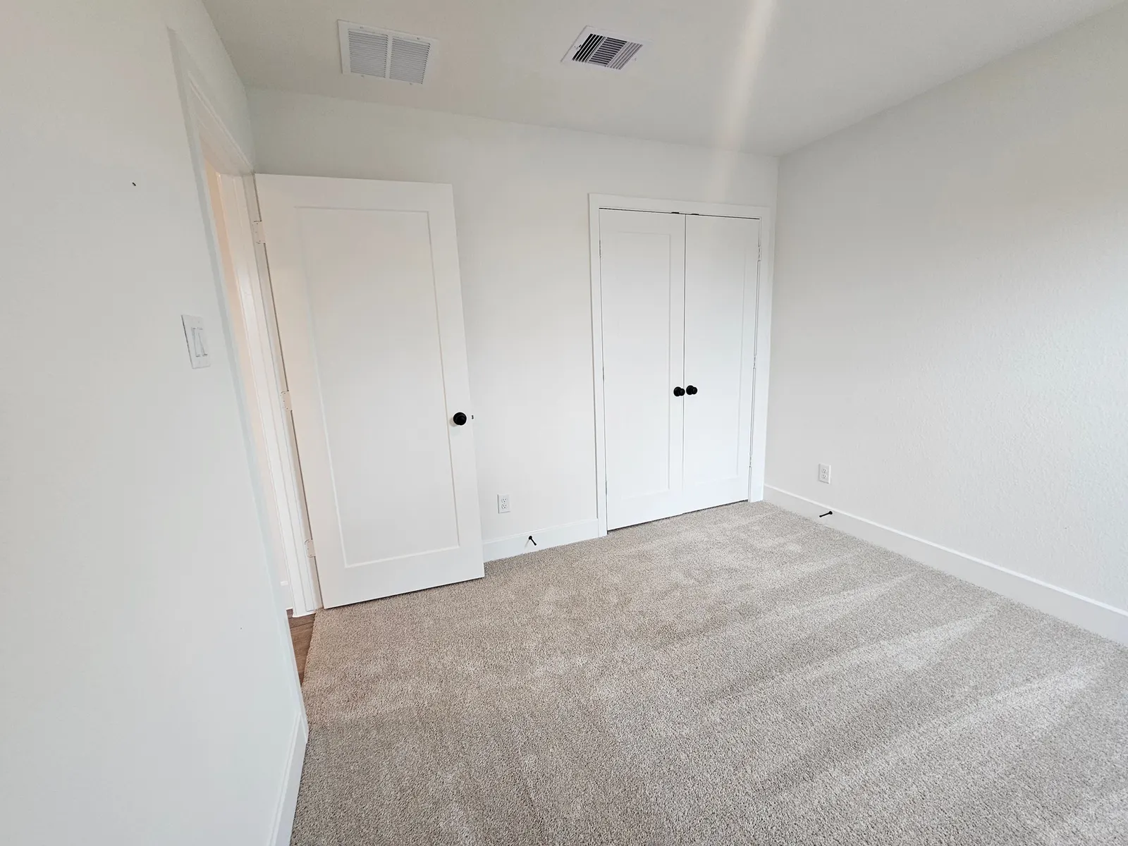 Carpeted bedroom with closet at 10727 Crockett Meadows, Conroe, TX