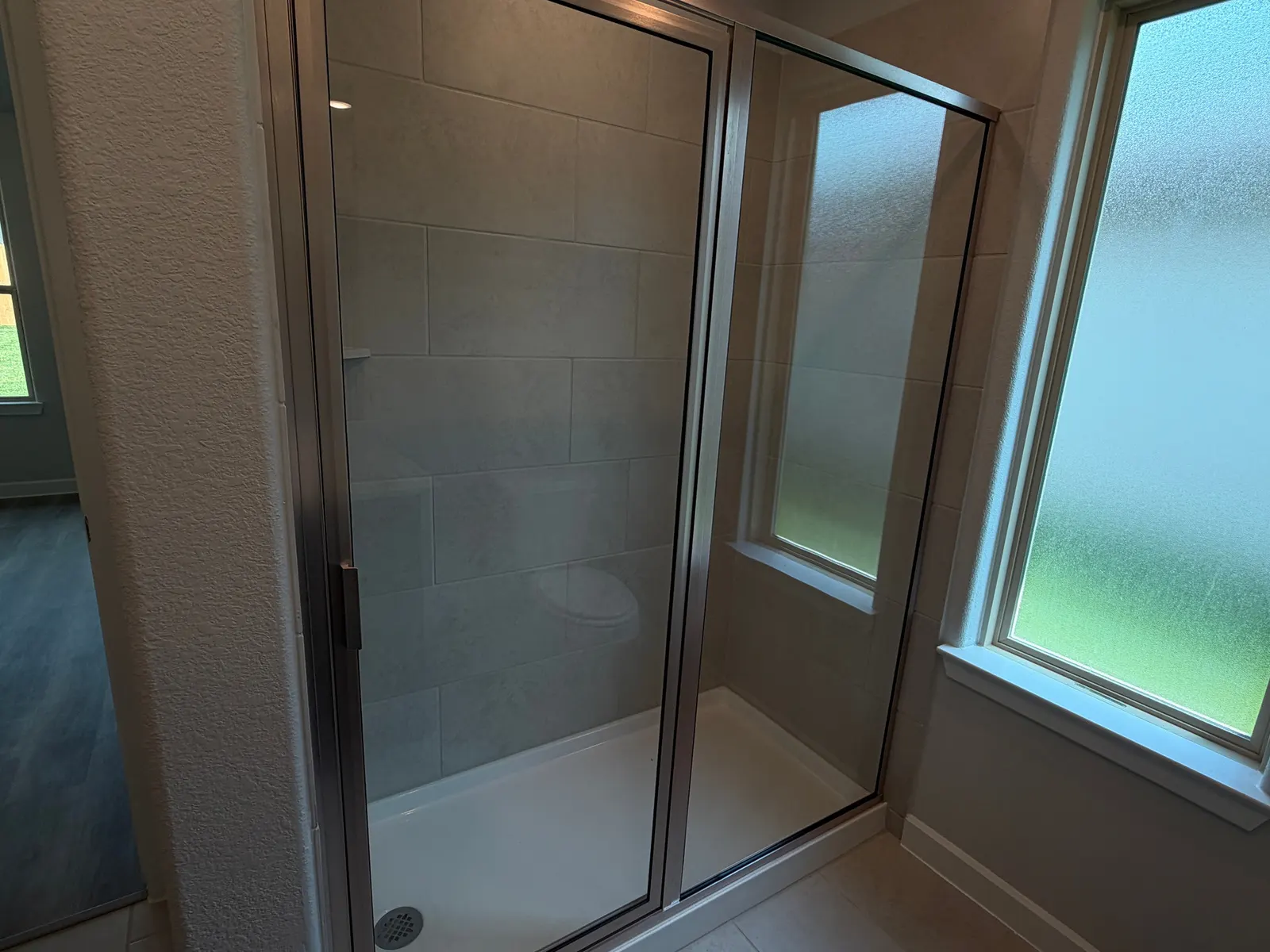 Primary bath walk in shower at 11858 Serena's Song Drive, Willis, TX