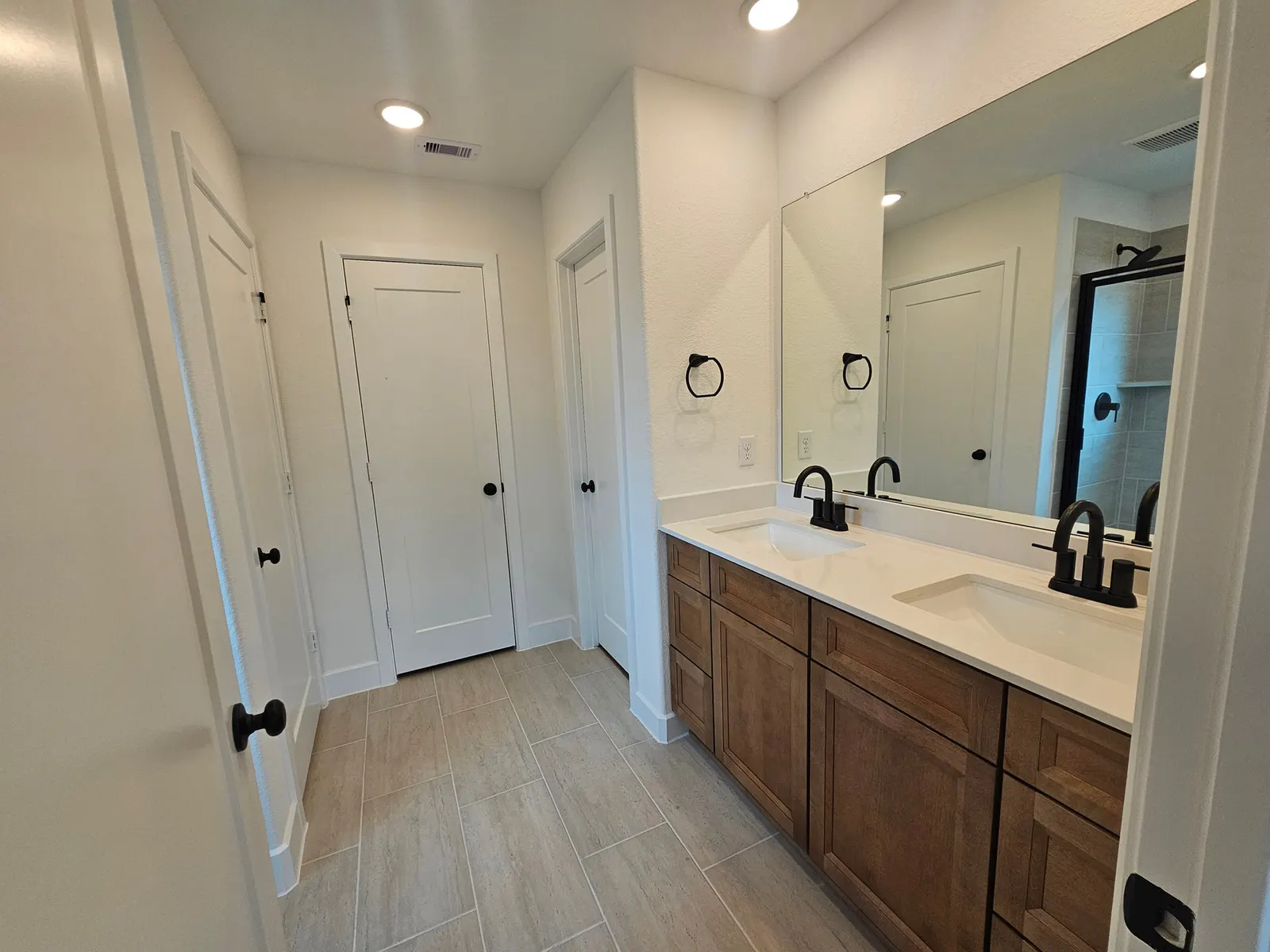 Primary bathroom with double vanity at 10727 Crockett Meadows, Conroe, TX