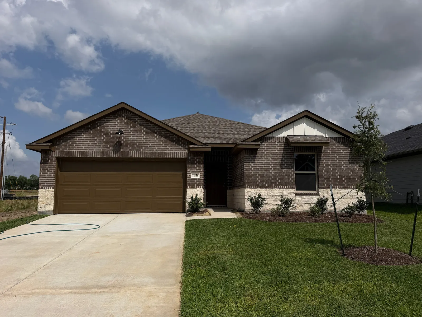 Front exterior of 11858 Serena's Song Drive, a new home by Alta Homes, Willis, TX