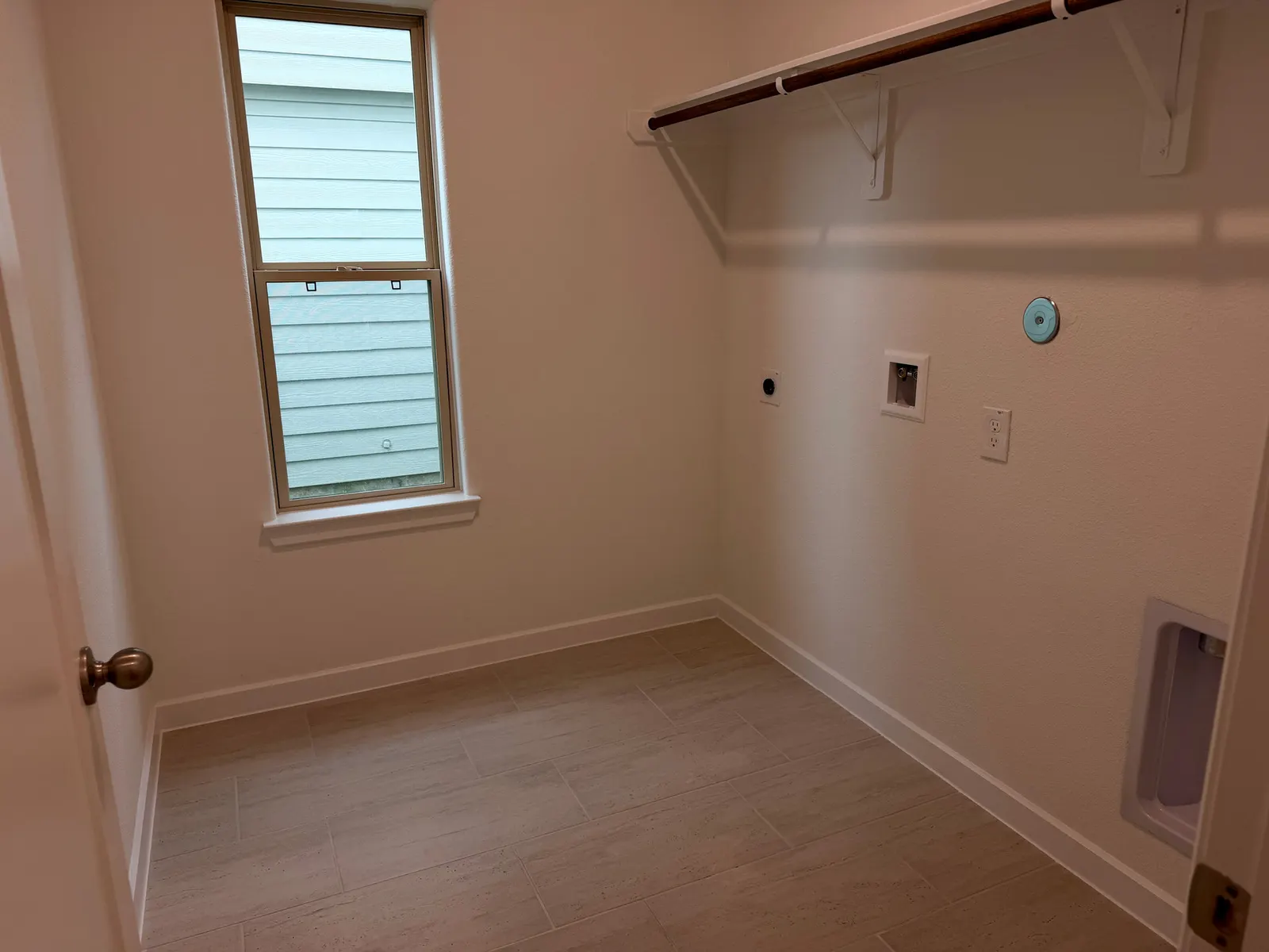 Utility and laundry room at 11830 Serena's Song Drive, Willis, TX