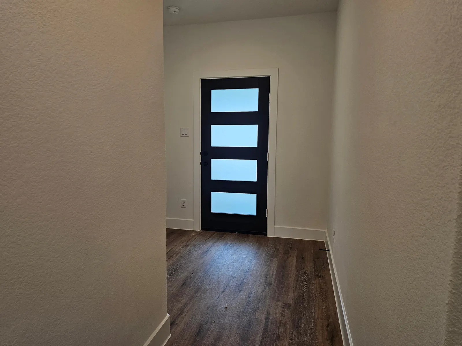 Entry with glass panel front door at 10727 Crockett Meadows, Conroe, TX