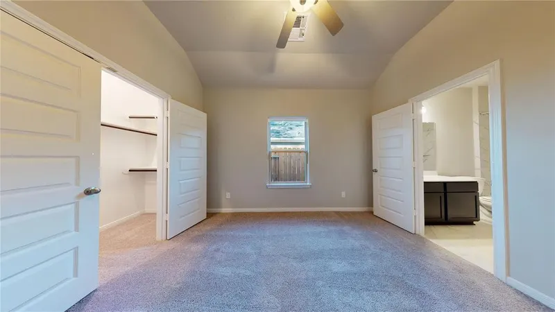 Bedroom with closet and ensuite bath at 16701 Eastchase Street, Montgomery, TX