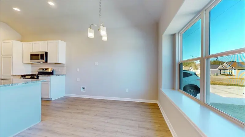 Living area open to the kitchen with window at 16701 Eastchase Street, Montgomery, TX