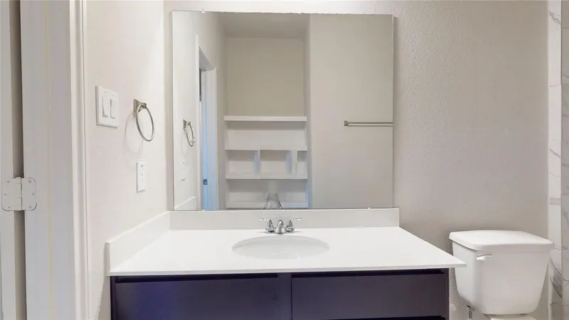 Bathroom vanity with mirror at 16701 Eastchase Street, Montgomery, TX