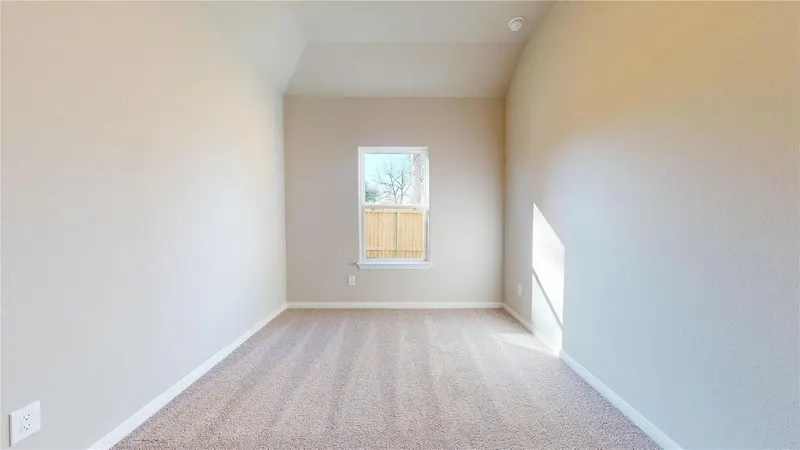 Carpeted bedroom with window at 16701 Eastchase Street, Montgomery, TX