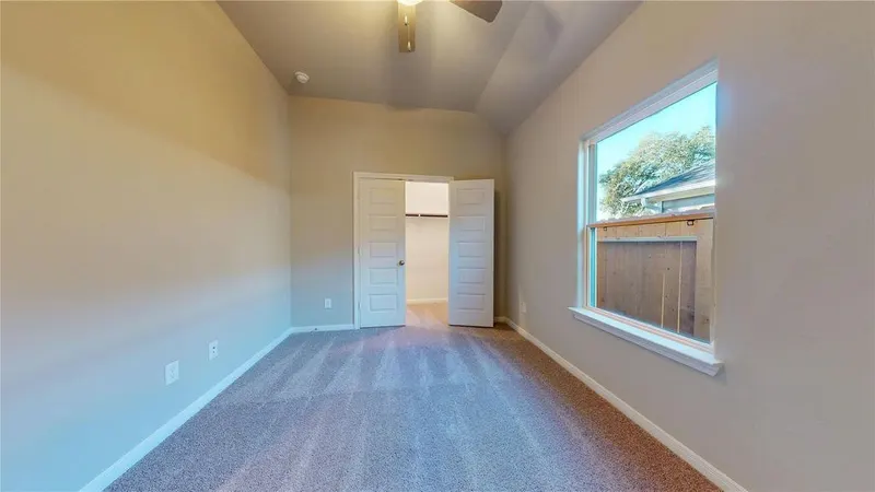 Bedroom with backyard window at 16701 Eastchase Street, Montgomery, TX