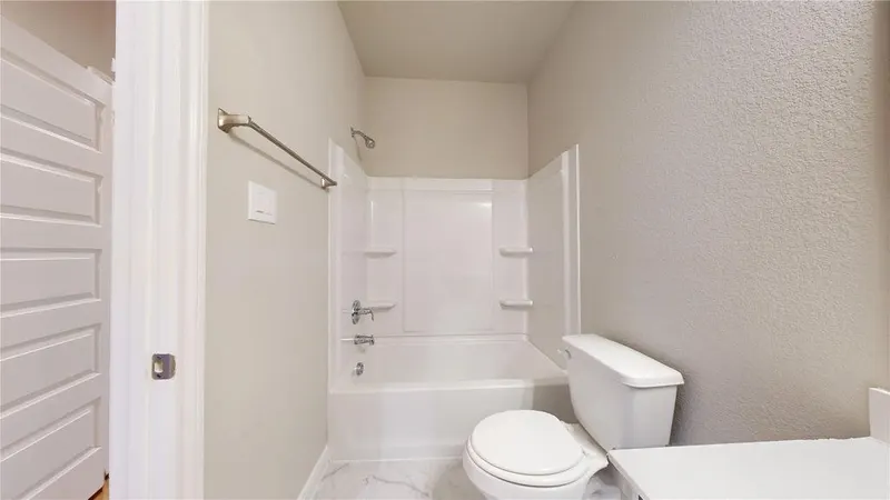 Secondary bathroom with tub and shower at 16701 Eastchase Street, Montgomery, TX