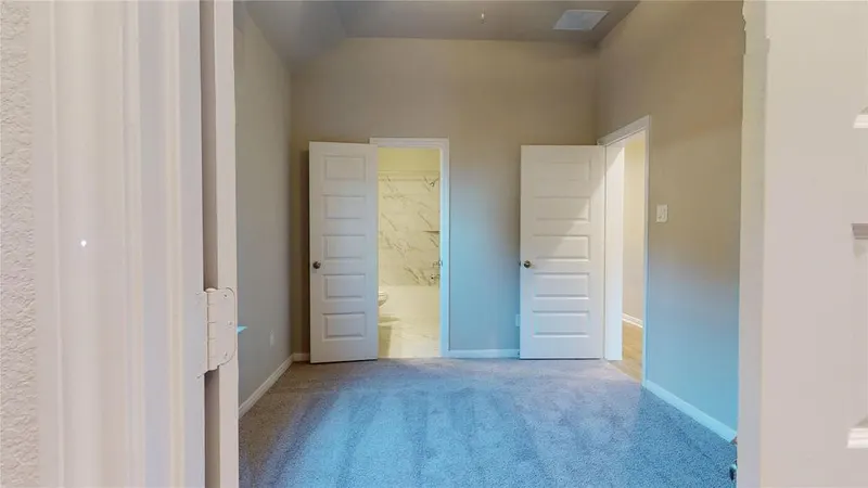 Bedroom with double doors at 16701 Eastchase Street, Montgomery, TX