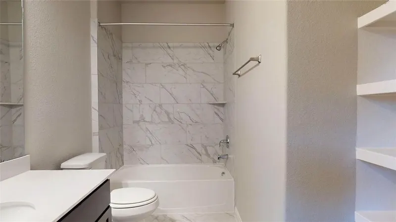 Bathroom with tub, shower and toilet at 16701 Eastchase Street, Montgomery, TX