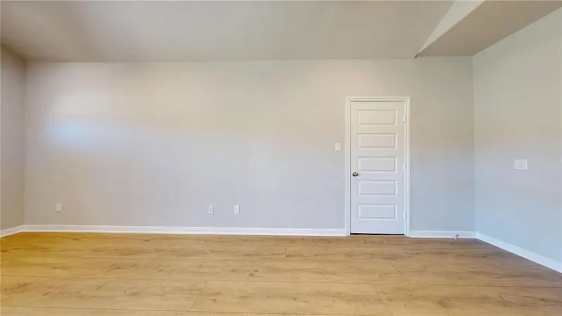 Living room with wood look flooring at 16701 Eastchase Street, Montgomery, TX
