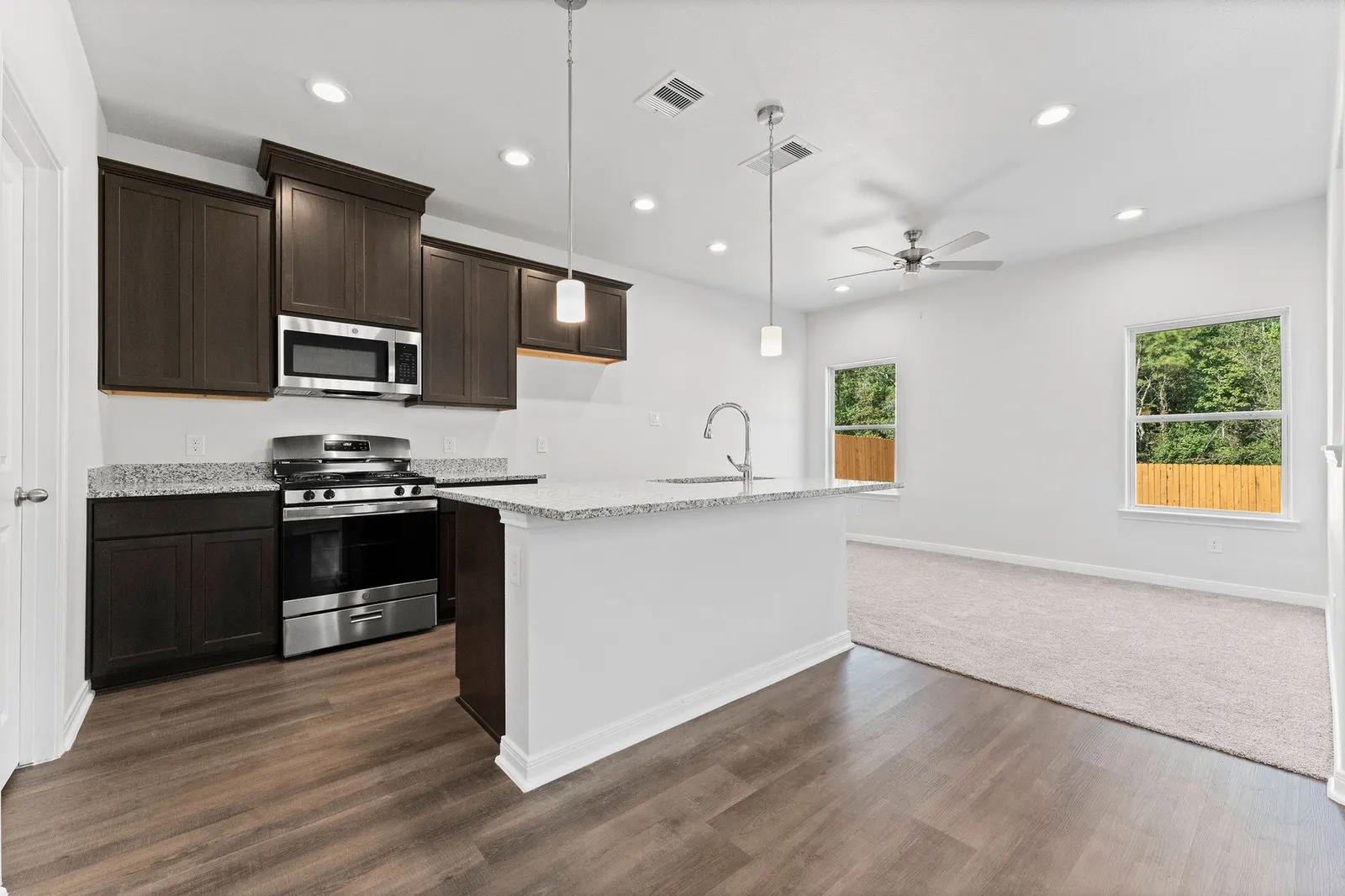 Kitchen open to the living area at Lake Conroe Village, Montgomery, TX