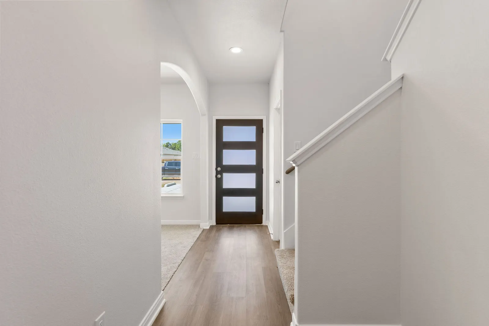 Entry hallway with staircase at Lake Conroe Village, Montgomery, TX