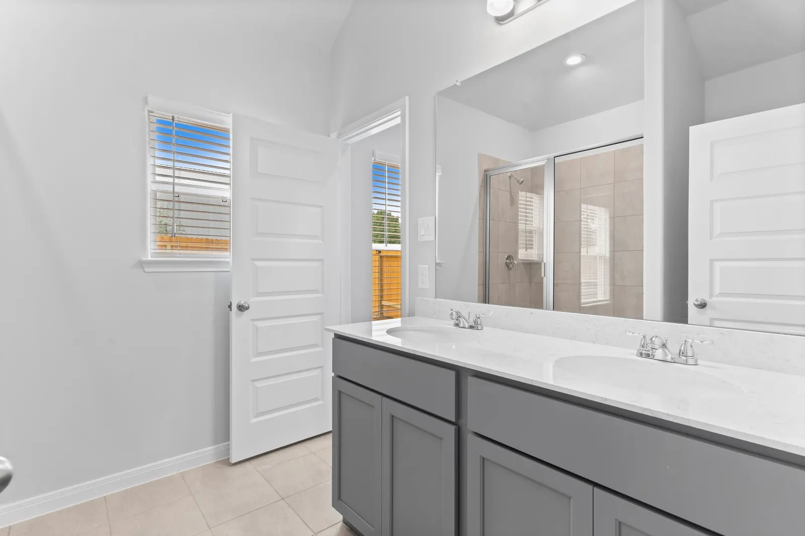 Primary bathroom with double vanity at Lake Conroe Village, Montgomery, TX