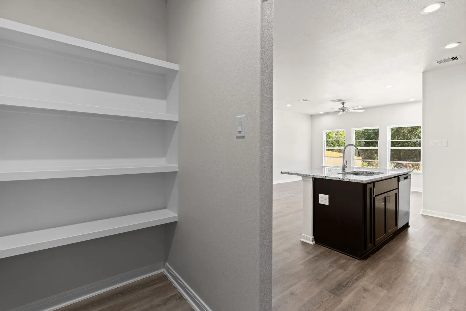 Pantry shelving beside the kitchen at Lake Conroe Village, Montgomery, TX