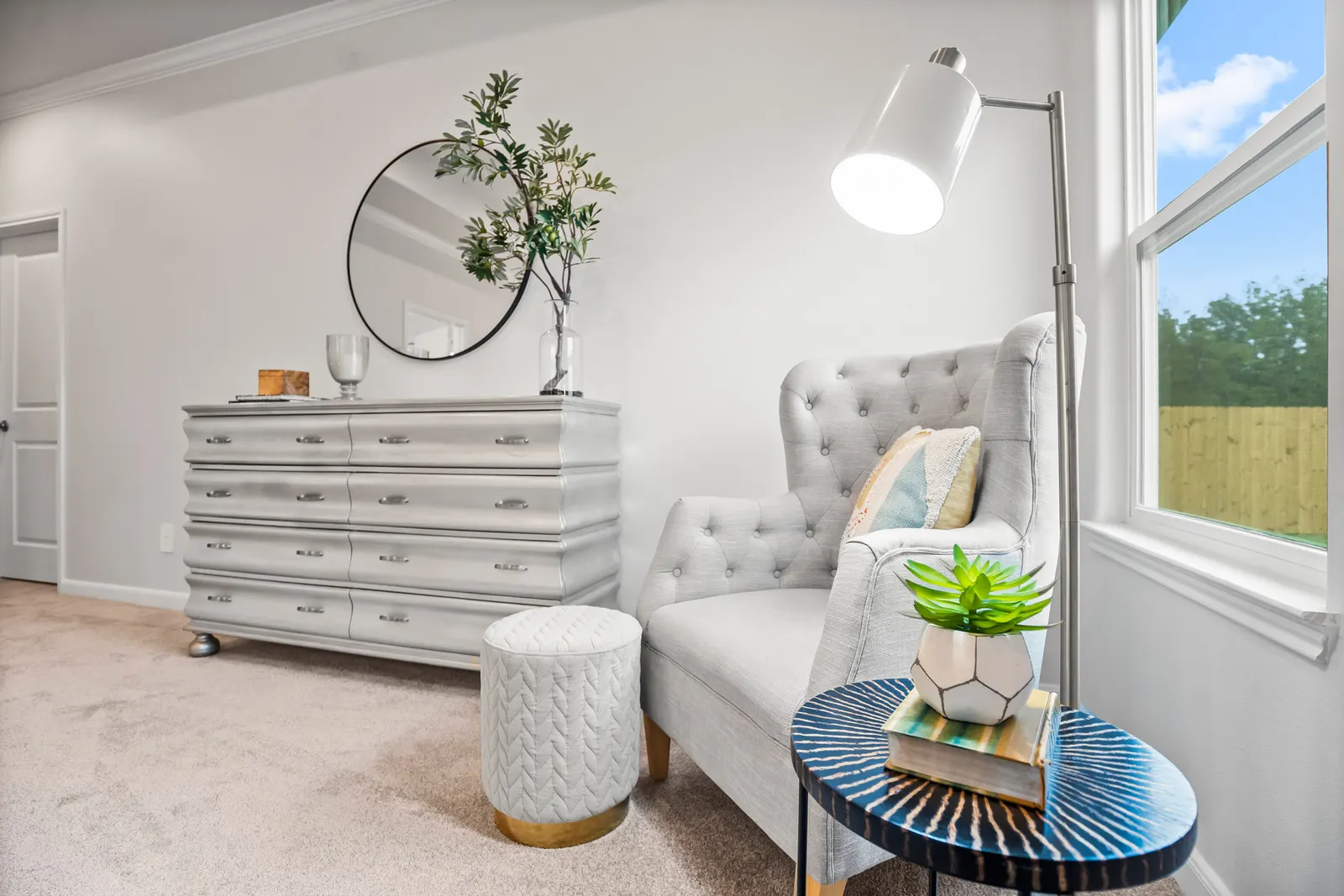 Cozy reading nook with built-in shelving in Alta Homes model home