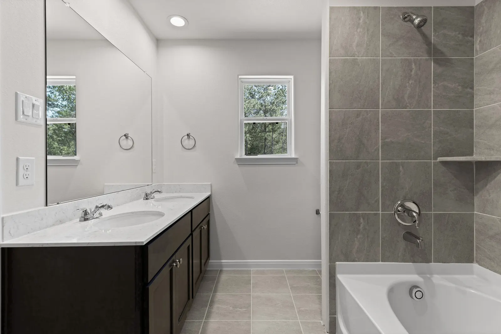 Primary bathroom with walk in shower and tub at Lake Conroe Village, Montgomery, TX