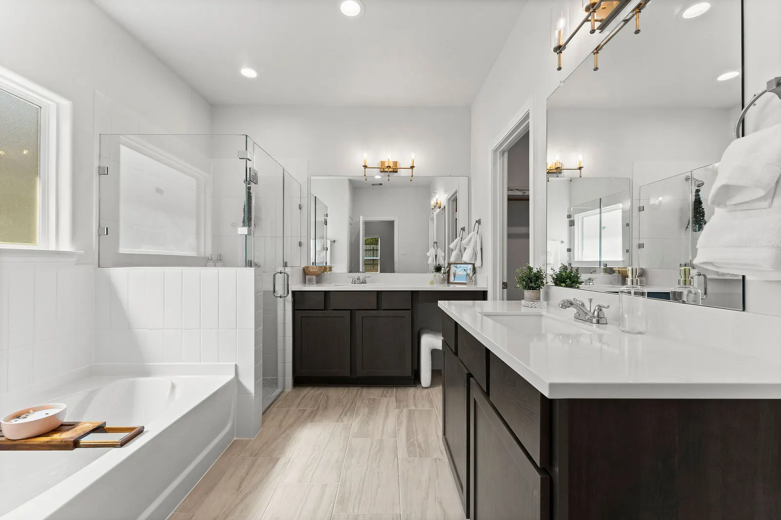 Open primary suite with tub in Alta Homes new home Texas