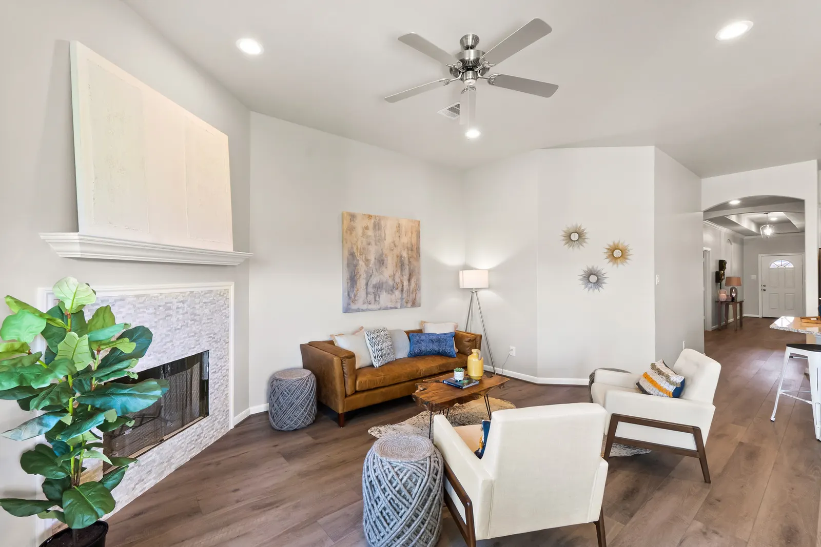 Open concept living room with neutral furniture in Alta Homes new home