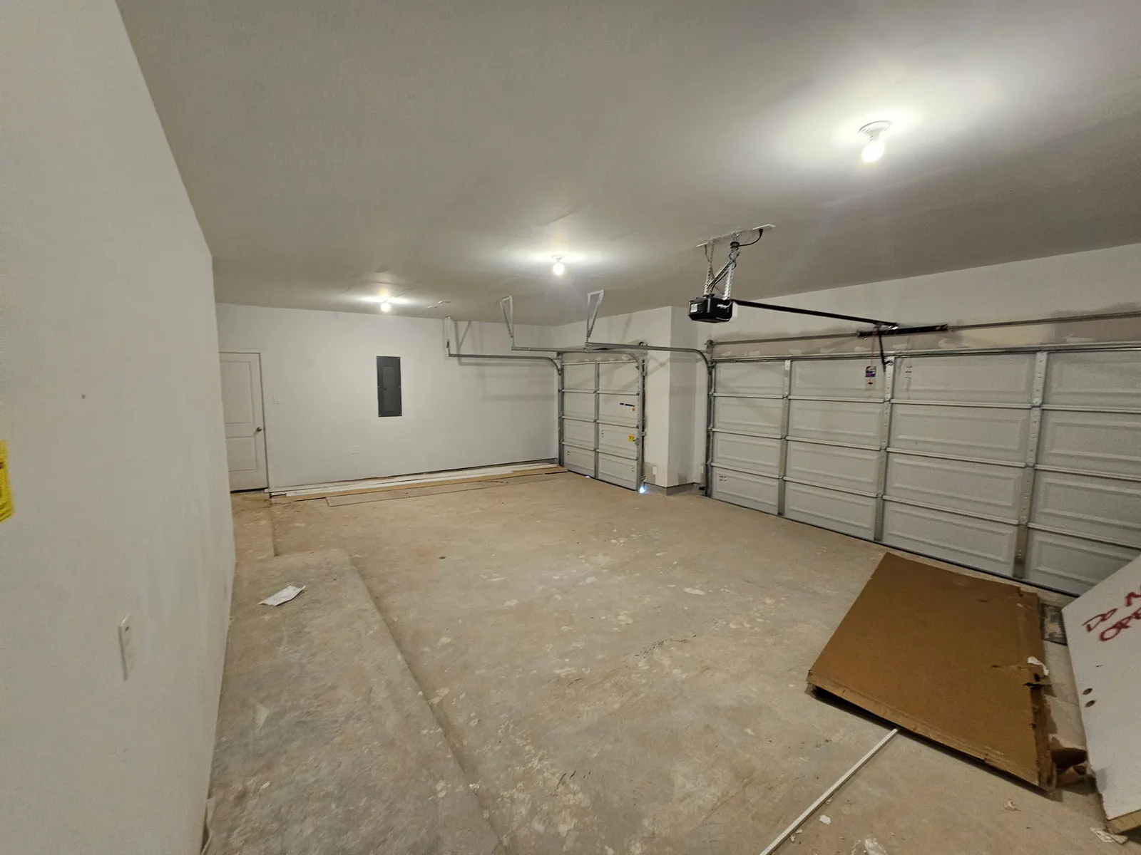 Interior of the attached garage at 11803 Serena's Song Drive, Willis, TX