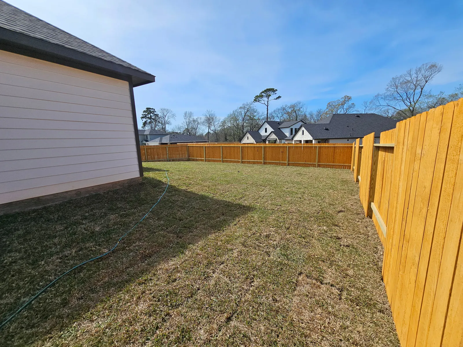 Fenced backyard at 11803 Serena's Song Drive, Willis, TX