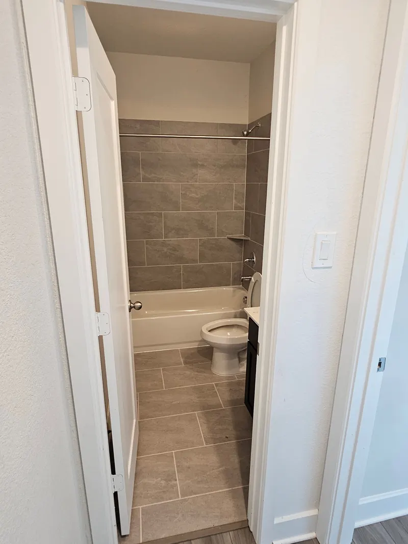 Bathroom with tub and shower at 11803 Serena's Song Drive, Willis, TX