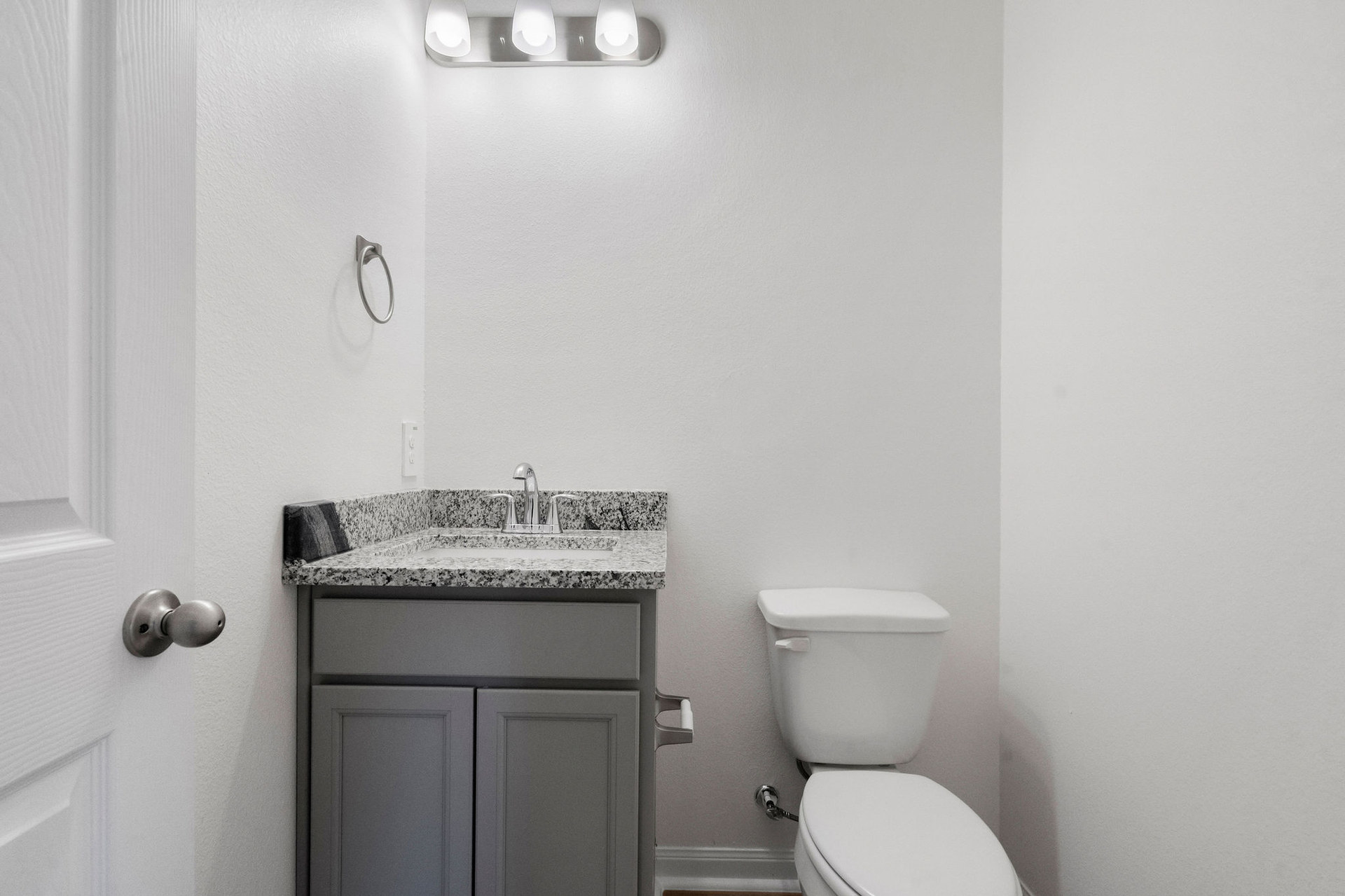 Powder bathroom with vanity at Cedar Crossing by Alta Homes
