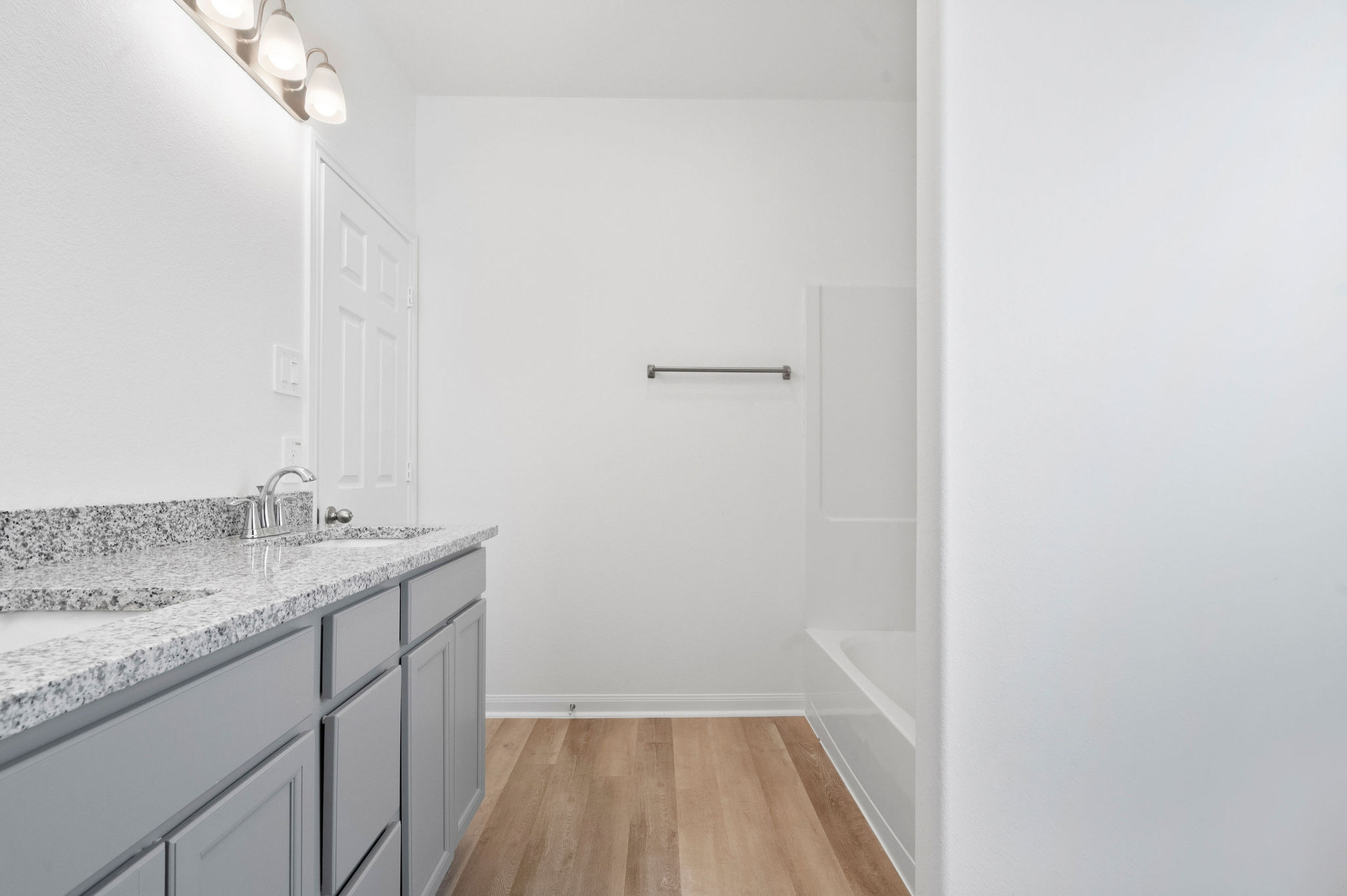 Bathroom vanity beside the shower at Cedar Crossing by Alta Homes
