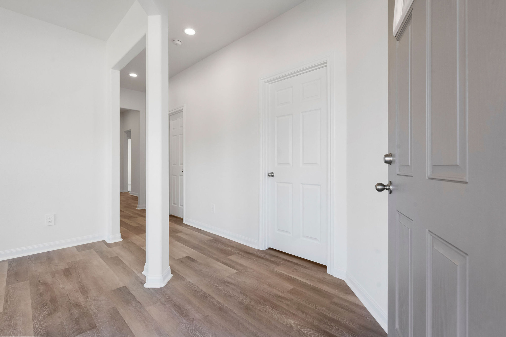 Entry hallway with column detail at Cedar Crossing by Alta Homes